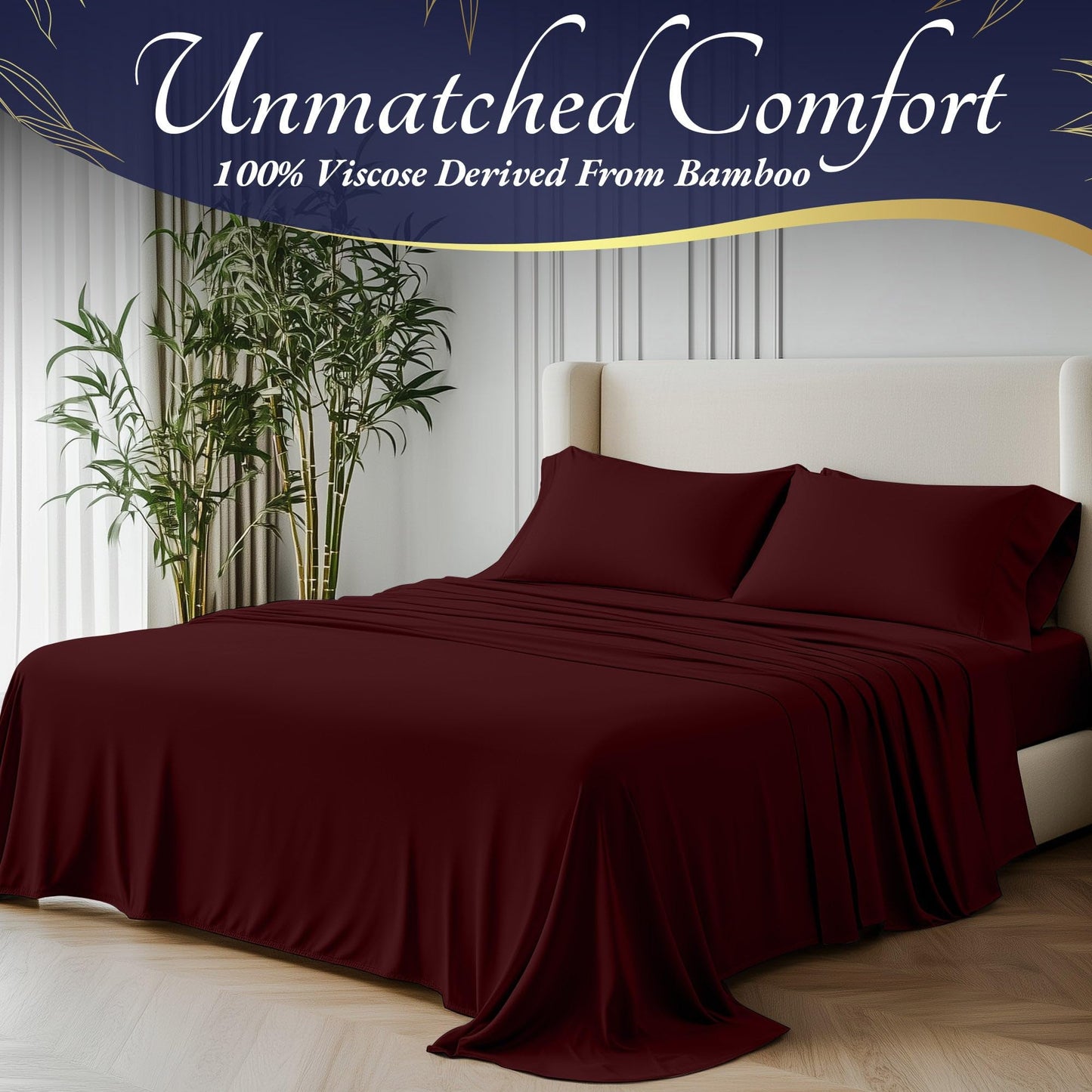 Burgundy bamboo viscose sheet set on bed with matching pillowcases in modern bedroom setting.