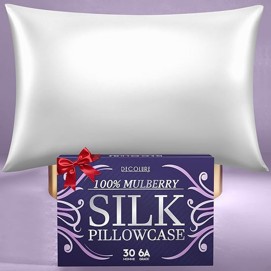 White silk pillowcase with smooth sheen on a purple background, accompanied by blue product box with decorative silver text.