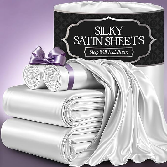 White satin sheet set with smooth, glossy finish, including fitted sheet, flat sheet, and pillowcases packaged in decorative .