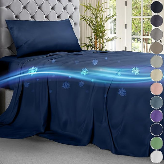 Navy blue cooling sheet set on bed with pillow and decorative cooling effect illustrations.