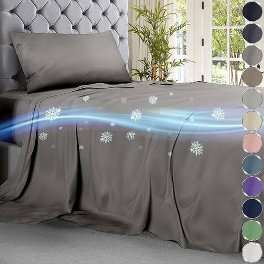 Cool grey cooling sheet set on tufted bed with subtle airflow and snowflake graphics.