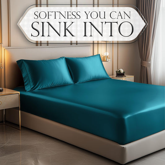 Sea teal satin fitted sheet on bed with matching pillowcases in modern bedroom setting.