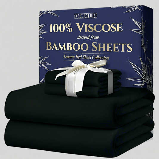 Black bamboo viscose sheet set with white ribbon, luxury bedding packaging in navy box.