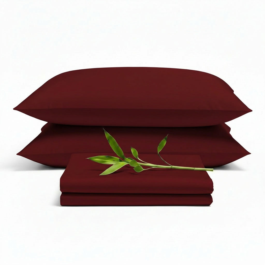 Decolure Burgundy bamboo sheet set 4-piece set including fitted sheet, flat sheet, and two pillowcases, neatly arranged