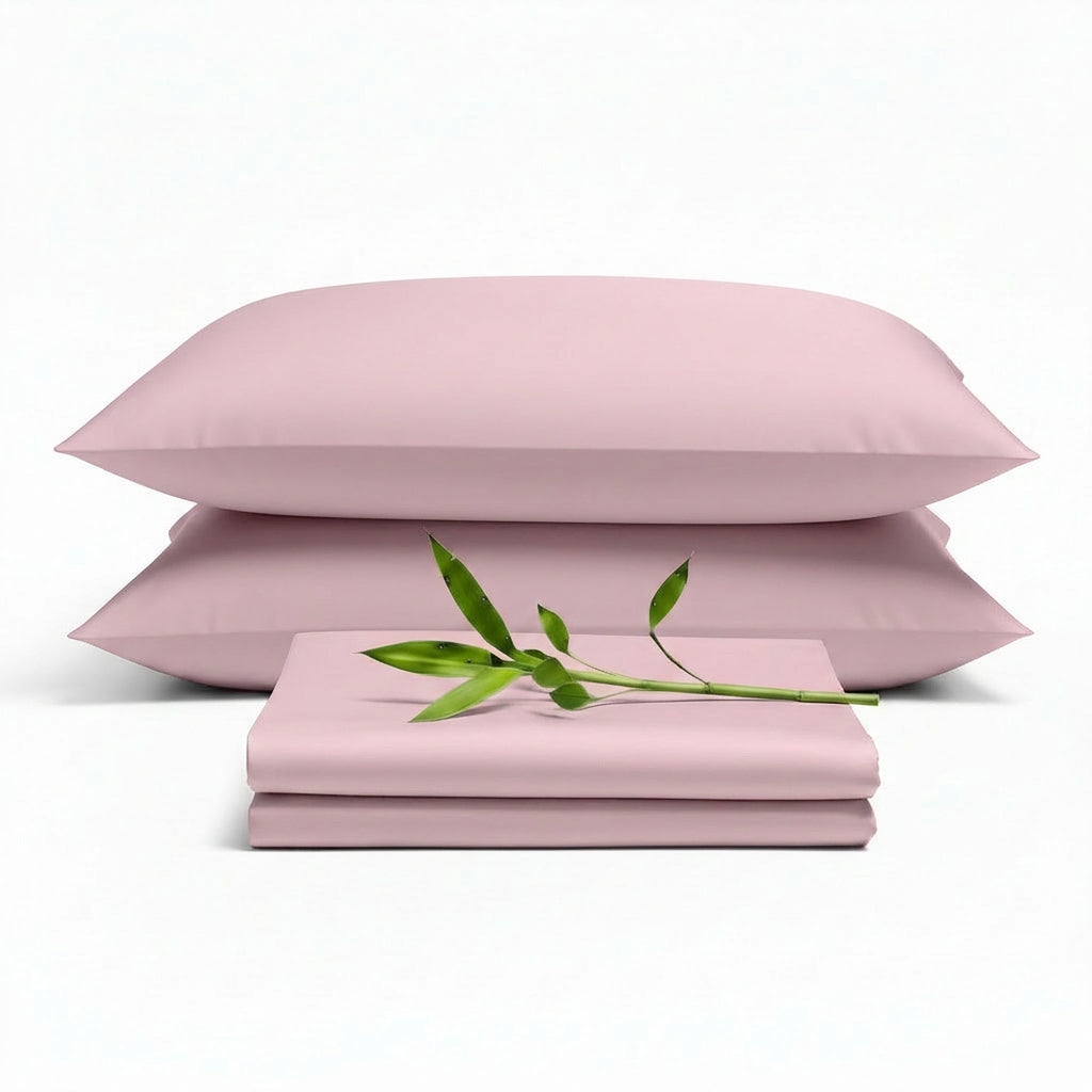 Decolure Light Pink bamboo sheet set 4-piece set including fitted sheet, flat sheet, and two pillowcases, neatly arranged