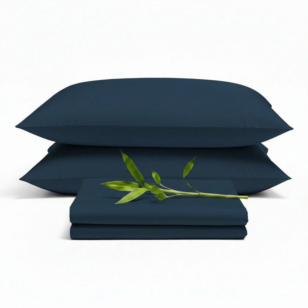 Decolure Navy Blue bamboo sheet set 4-piece set including fitted sheet, flat sheet, and two pillowcases, neatly arranged
