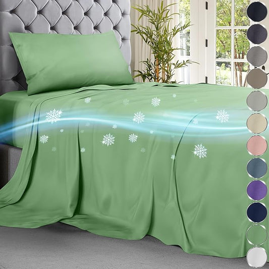 Sage green cooling sheet set on tufted bed with snowflake and breeze graphics.