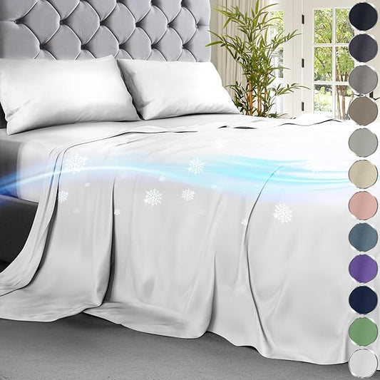White cooling sheet set on bed with tufted gray headboard and cooling airflow graphic.