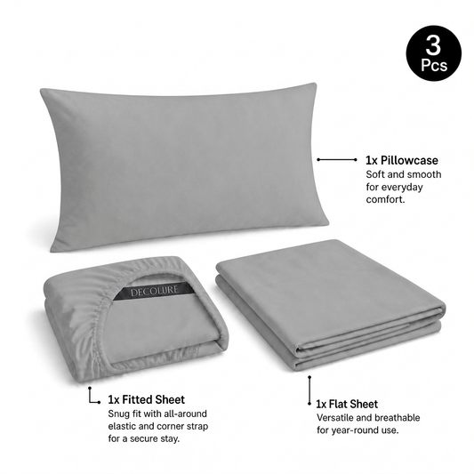 Light gray Decolure sheet set shown as 3 pieces: one pillowcase, one folded fitted sheet and one folded flat sheet.