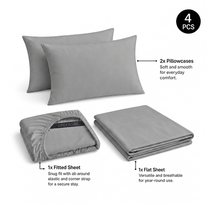 Light gray Decolure sheet set shown as 4 pieces: 2 pillowcases, one folded fitted sheet and one folded flat sheet.