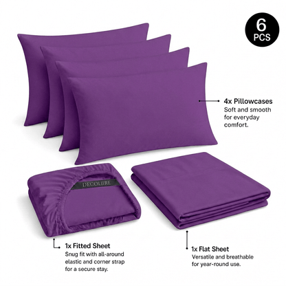 Purple Decolure sheet set shown as 6 pieces: 4 pillowcases, one folded fitted sheet and one folded flat sheet.
