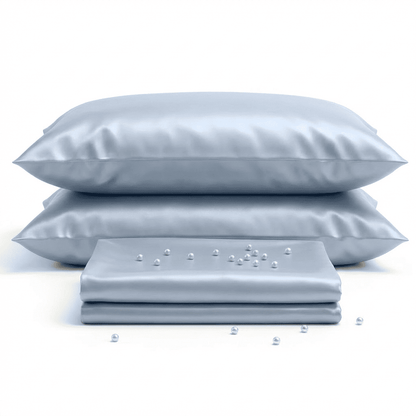 Set of light blue pillows and a folded sheet on a white background