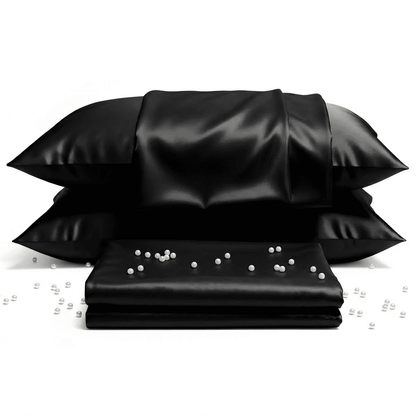 Black satin pillowcases with pearls on a white background