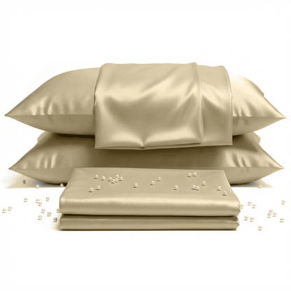 Beige satin pillowcases and sheet set on a white background