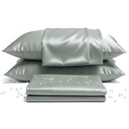 Gray satin pillowcases with pearls on a white background