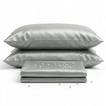 Gray satin pillowcases and a matching fabric strip on a white background