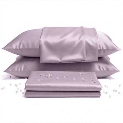 Purple satin pillowcases and sheet set with pearls on a white background