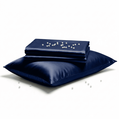 Navy satin pillowcase with pearls on a white background