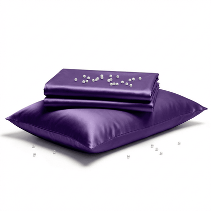 Purple satin pillow and pillowcase set on a white background