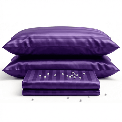 Purple satin pillowcases with pearls on a white background