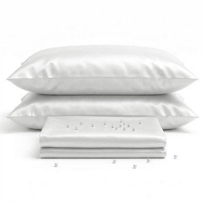 White pillows and a white sheet on a white background