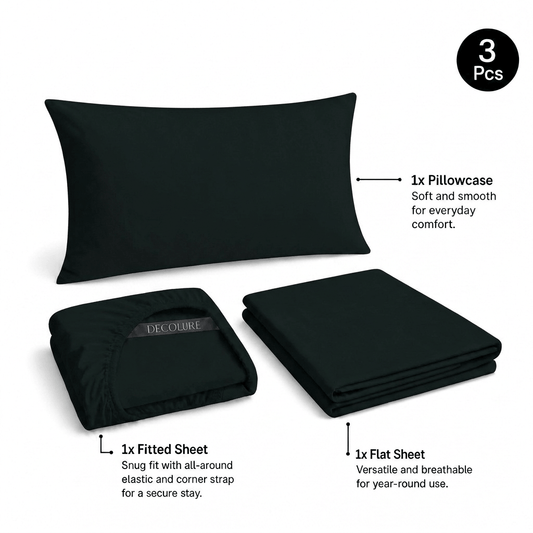 Black Decolure sheet set shown as 3 pieces: one pillowcase, one folded fitted sheet and one folded flat sheet.