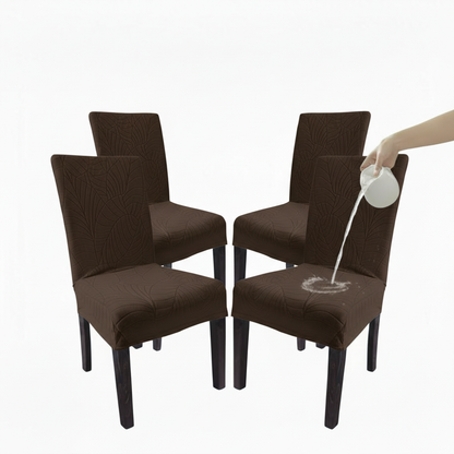 Brown chair covers on chairs with a hand pouring water onto one of them.