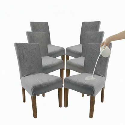 Set of six gray dining chairs with a person pouring water onto one chair.