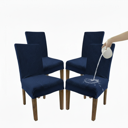 Navy blue chair covers on chairs with a hand pouring water onto one of them.