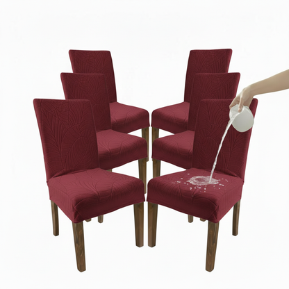 Set of six red chairs with a hand pouring water onto one chair, demonstrating water resistance.