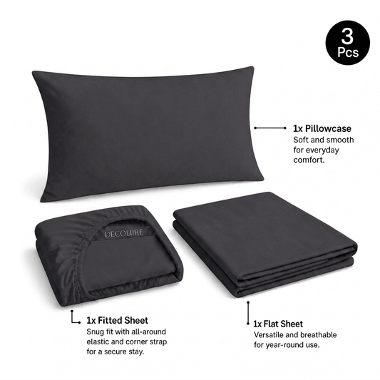 Charcoal gray Decolure sheet set shown as 3 pieces: one pillowcase, one folded fitted sheet and one folded flat sheet.