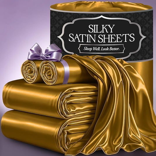 Luxurious gold satin sheet set with smooth, glossy finish, wrapped and folded elegantly.