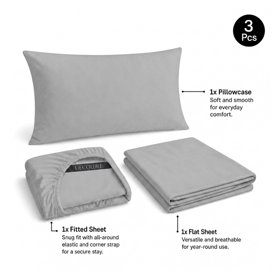 Light gray Decolure sheet set shown as 3 pieces: one pillowcase, one folded fitted sheet and one folded flat sheet.