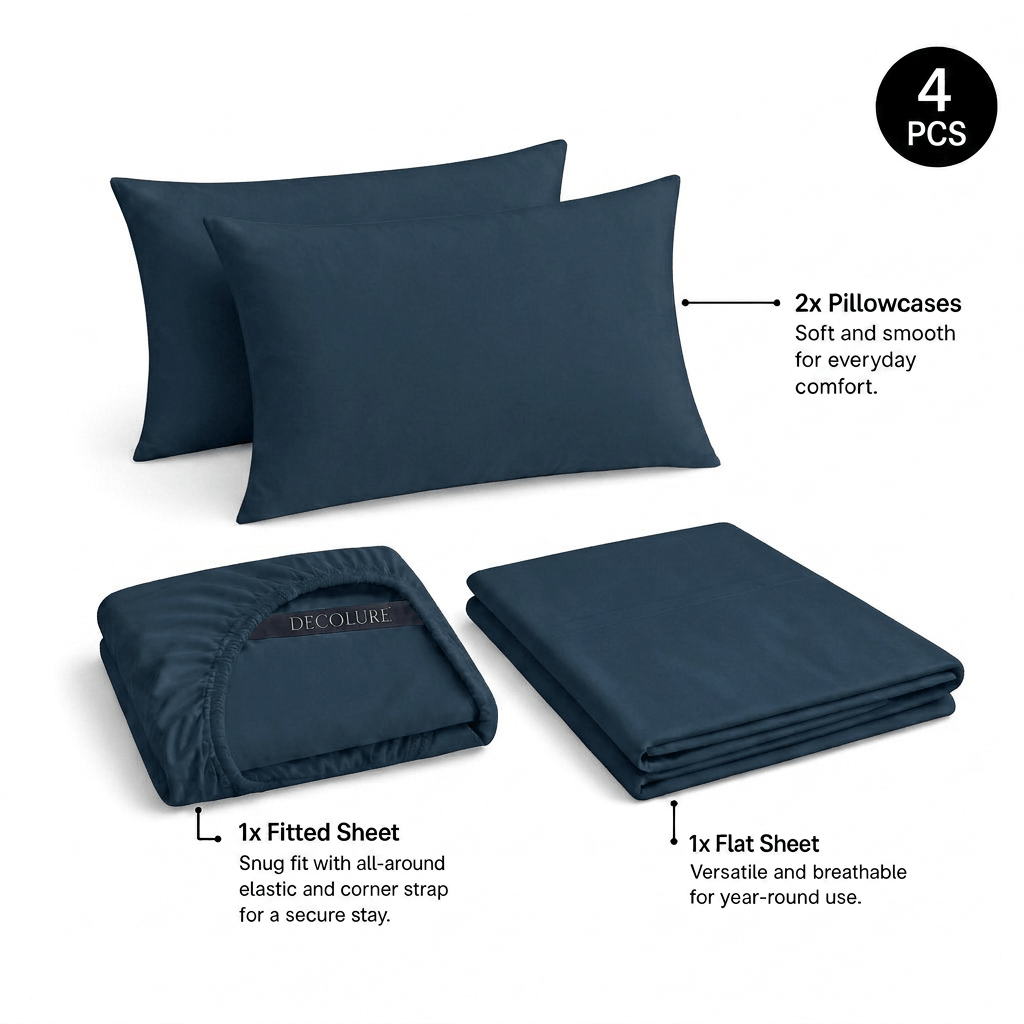 Navy blue Decolure sheet set shown as 4 pieces: 2 pillowcases, one folded fitted sheet and one folded flat sheet.