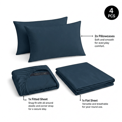 Navy blue Decolure sheet set shown as 4 pieces: 2 pillowcases, one folded fitted sheet and one folded flat sheet.