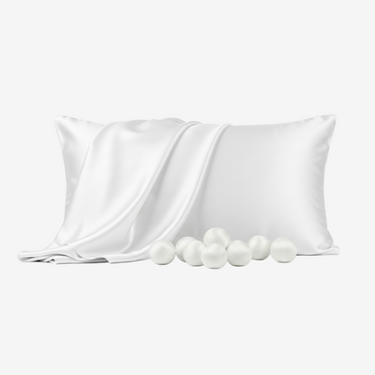 White silk pillowcase with smooth sheen, accompanied by soft silk cocoons on a white background.