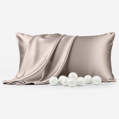 Champagne-colored silk pillowcase with soft draping and white silk pearls in front.