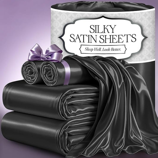 Stone grey silky satin sheet set with smooth, shiny texture and elegant drape, neatly folded and tied with a lavender satin.